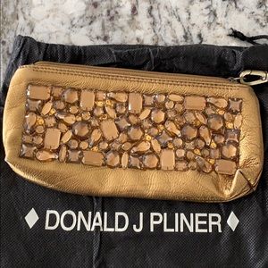 Donald Pliner metallic wristlet/clutch.